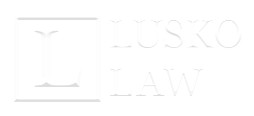Lusko Law horizontal white logo footer Pensacola law firm